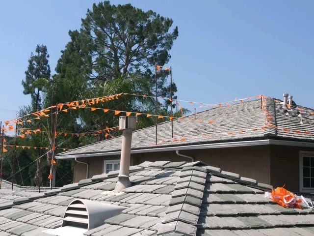 view from on top of a house to show the installation of story poles for a second story to be added